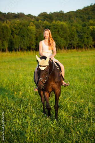 Active young woman ride a horse in nature © Samo Trebizan