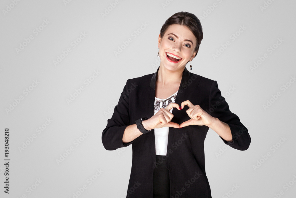 Love concept. Creative woman showing heart shape sign Love concept. Creative woman showing heart shape sign