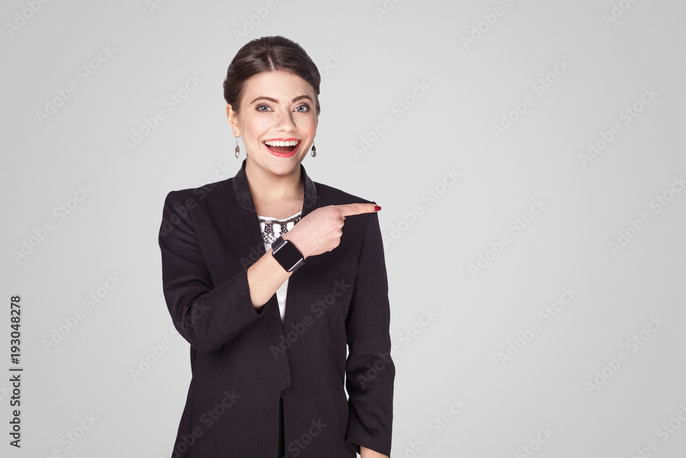 Happiness businesswoman pointing finger at copy space Happiness businesswoman pointing finger at copy space
