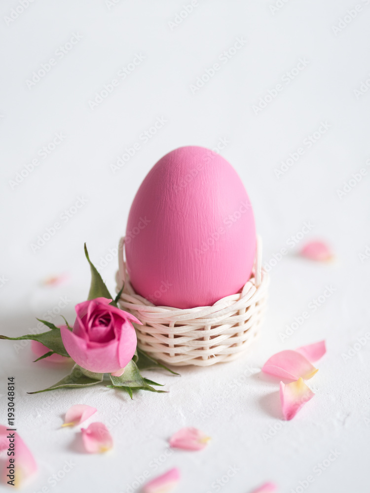Decorative Easter eggs and pink roses on light background. Holiday card. Decorative Easter eggs and pink roses on light background. Holiday card.