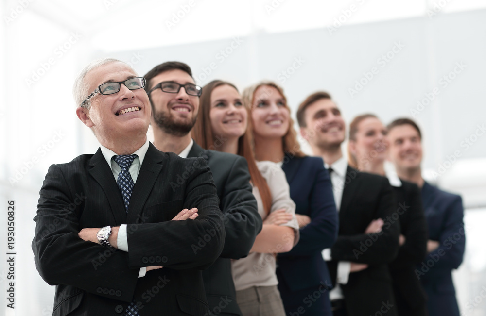 senior businessman and his team are confident looking ahead. senior businessman and his team are confident looking ahead.