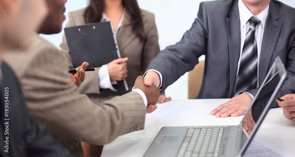 handshake business partners at a business meeting handshake business partners at a business meeting