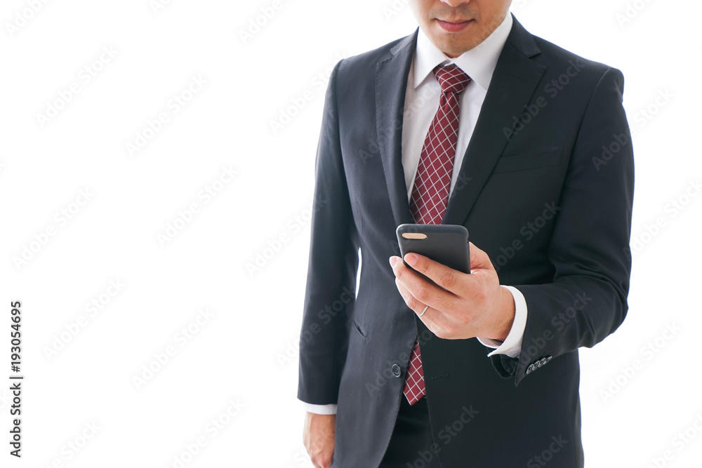 スマホを使うビジネスマン スマホを使うビジネスマン