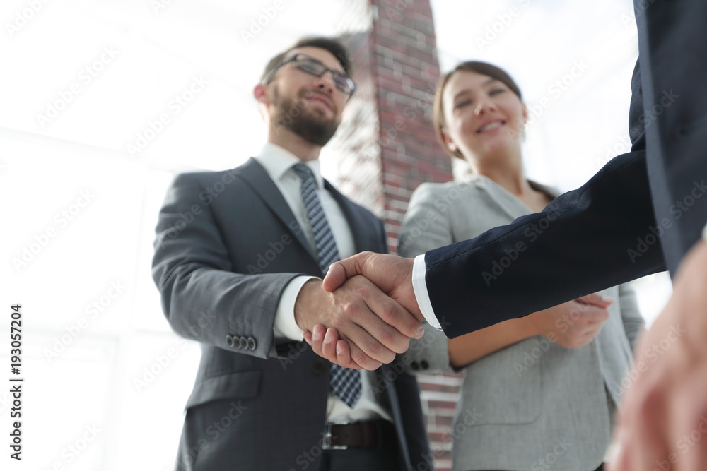 friendly handshake of business people. friendly handshake of business people.