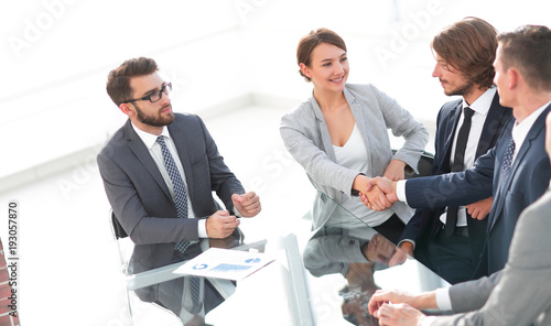 handshake business women with business partner