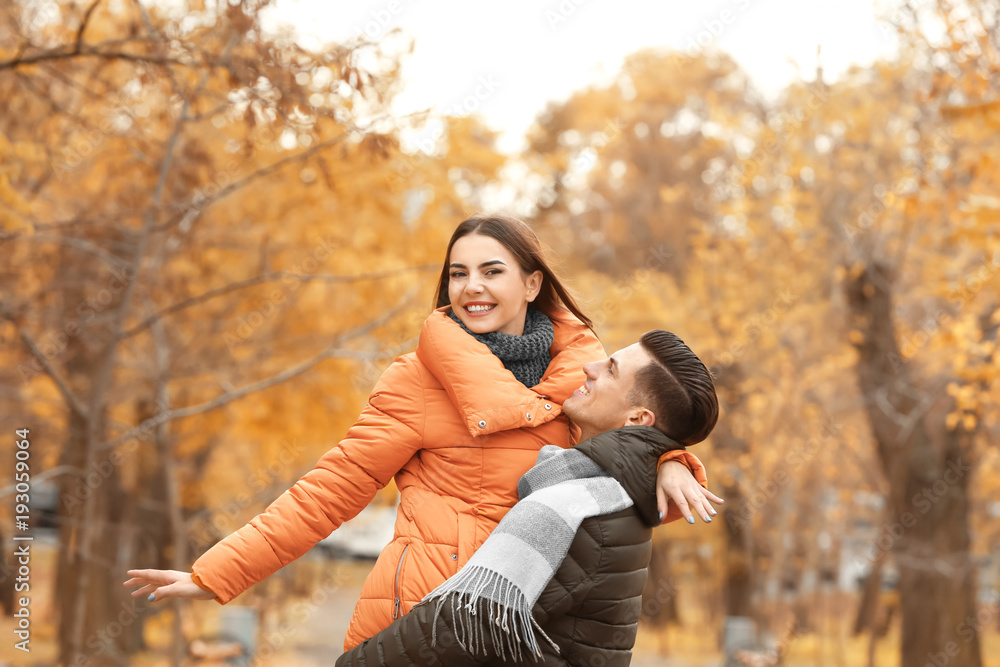 Beautiful couple in warm clothes in park Beautiful couple in warm clothes in park