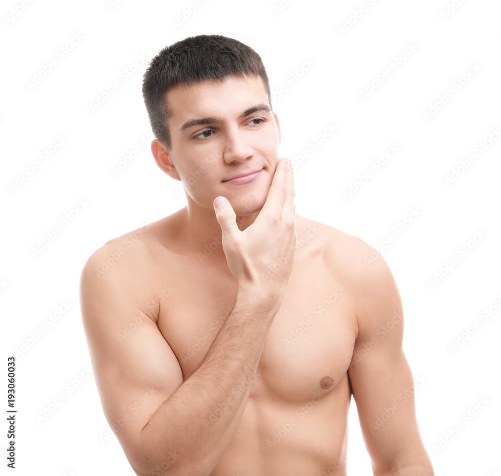Handsome young man with soft skin after shaving against white background Handsome young man with soft skin after shaving against white background
