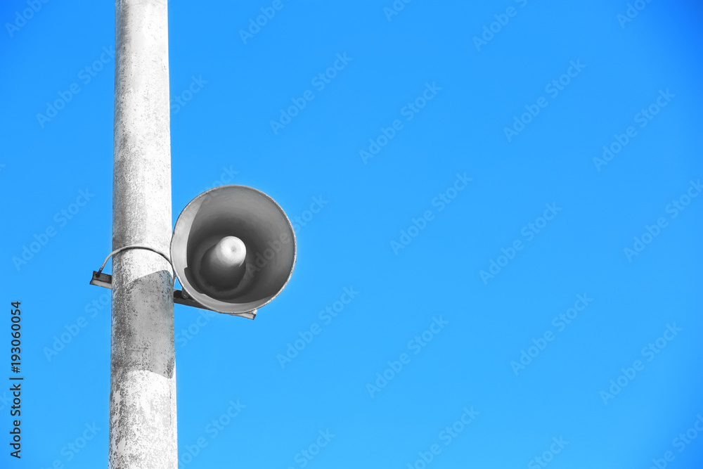 Megaphone on pole outdoors