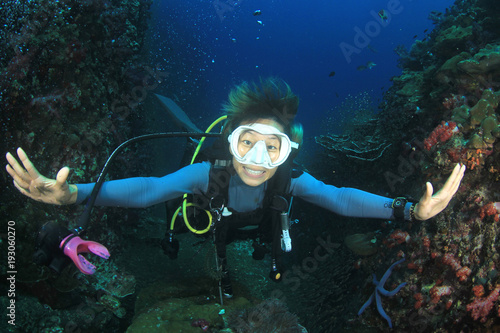Scuba dive. Young Asian woman scuba diving