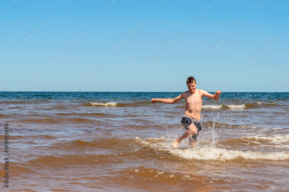 Boy playing on the Cavendish beach