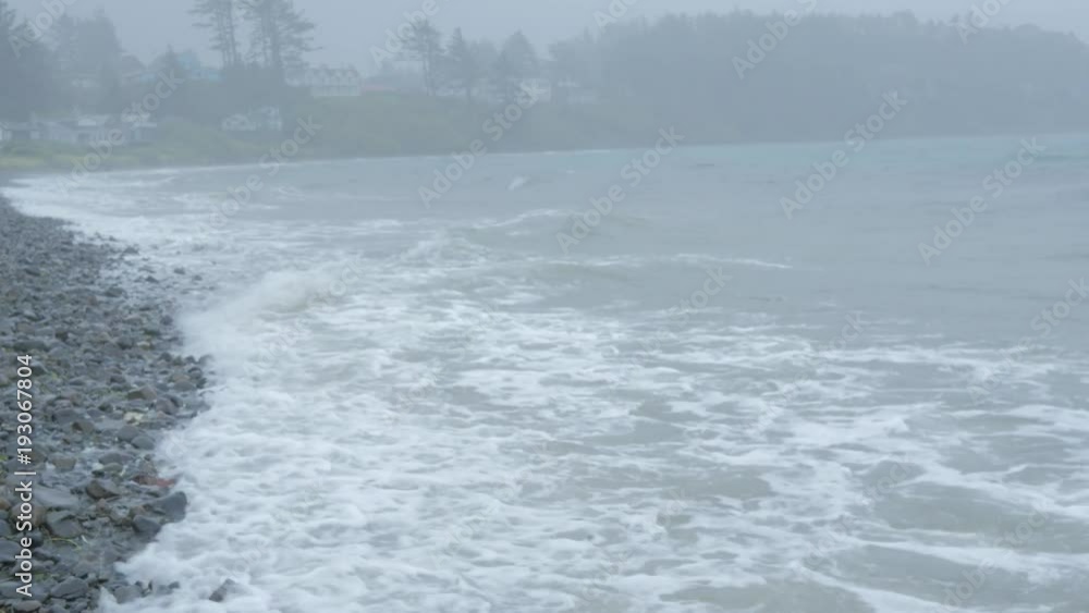 Coastal Homes on a Rocky Beach During a Storm. Coastal Homes on a Rocky Beach During a Storm.