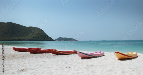 canoes on the beach with beautiful sky