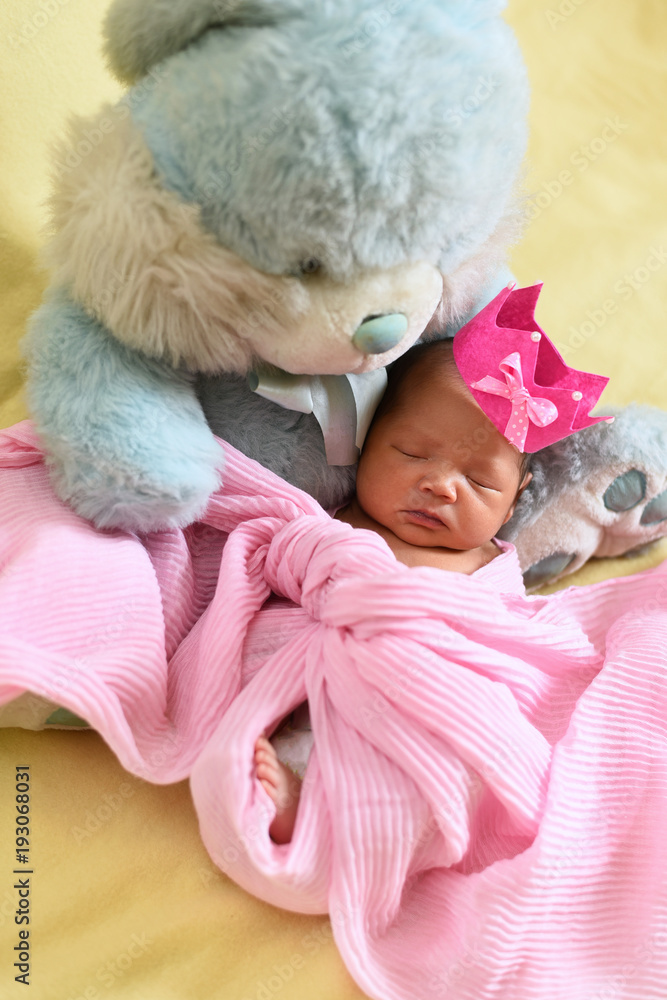 asian newborn baby sleeping with teddy bear. growth and childhood concept asian newborn baby sleeping with teddy bear. growth and childhood concept