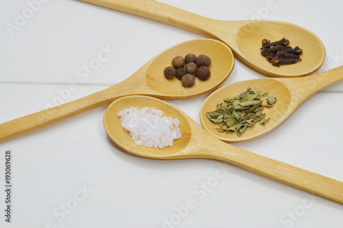 wooden spoons arrangement with spices top view