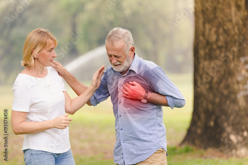 Senior men cardiac arrest heart attack in park.Severe heartache