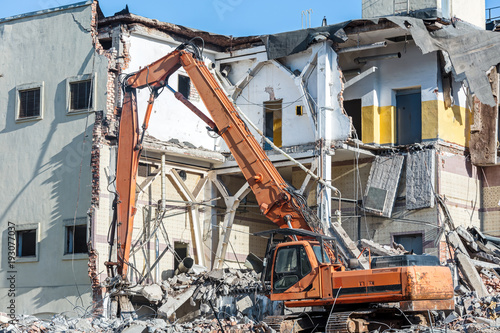 demolition of old building with excavator for new construction © Mr Twister
