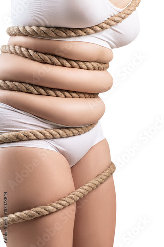 Fat woman in white underwear twisted with a rope.