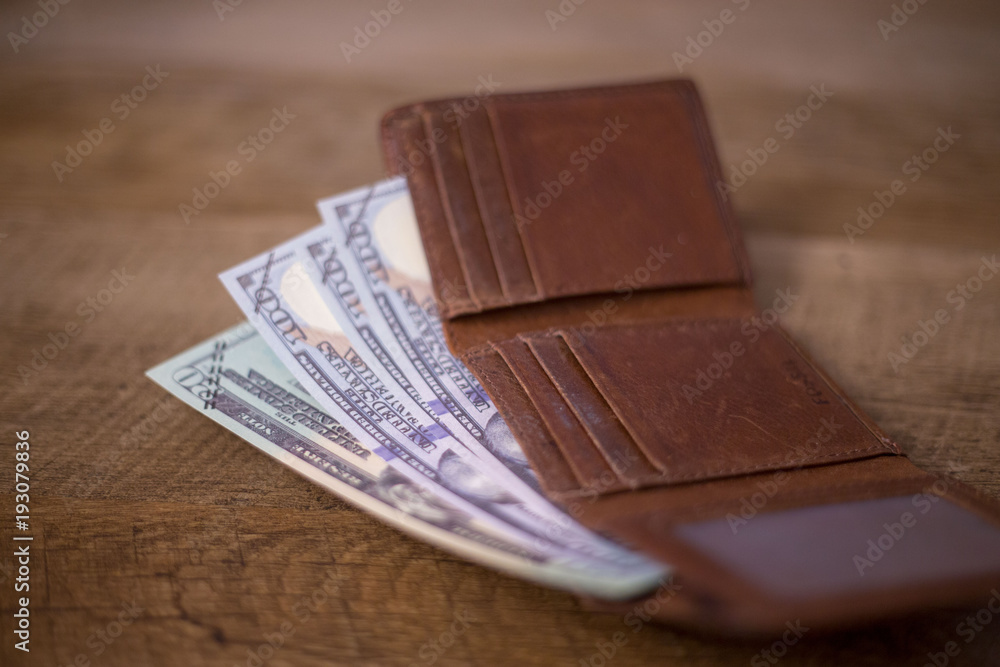 Money in Wallet on Coffee Table Money in Wallet on Coffee Table