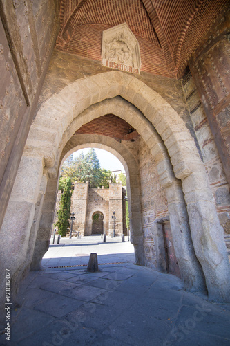 gate in turret of Alcantara bridge  landmark and monument from ancient arab age  in Toledo city  Spain  Europe. Vertical  