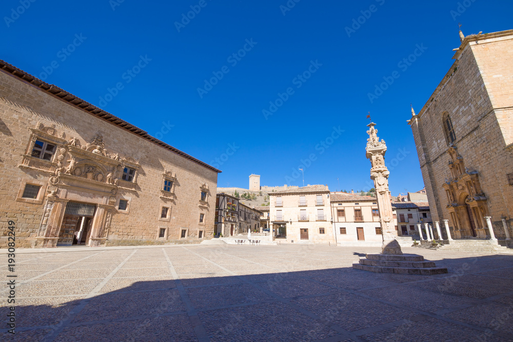 Main square in Penaranda de Duero village, with Palace of the Counts of Miranda, Parish of Santa Ana and Rollo or Court Pillar, in Burgos, Castile and Leon, Spain, Europe
