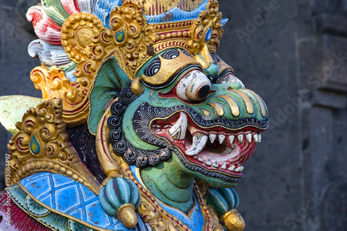 Traditional Balinese statue of Barong on a street temple in Bali, Indonesia © OlegD