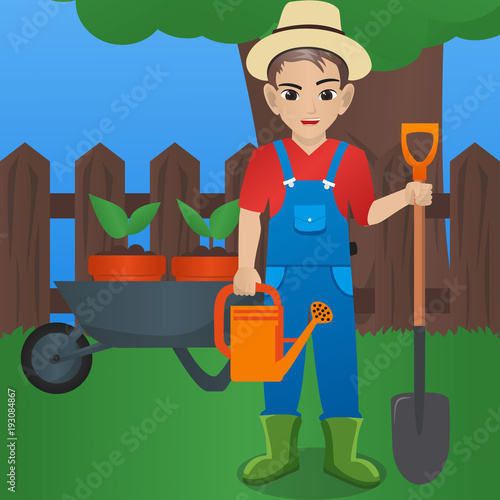 Male Gardener Holding  Watering Can and Shovel