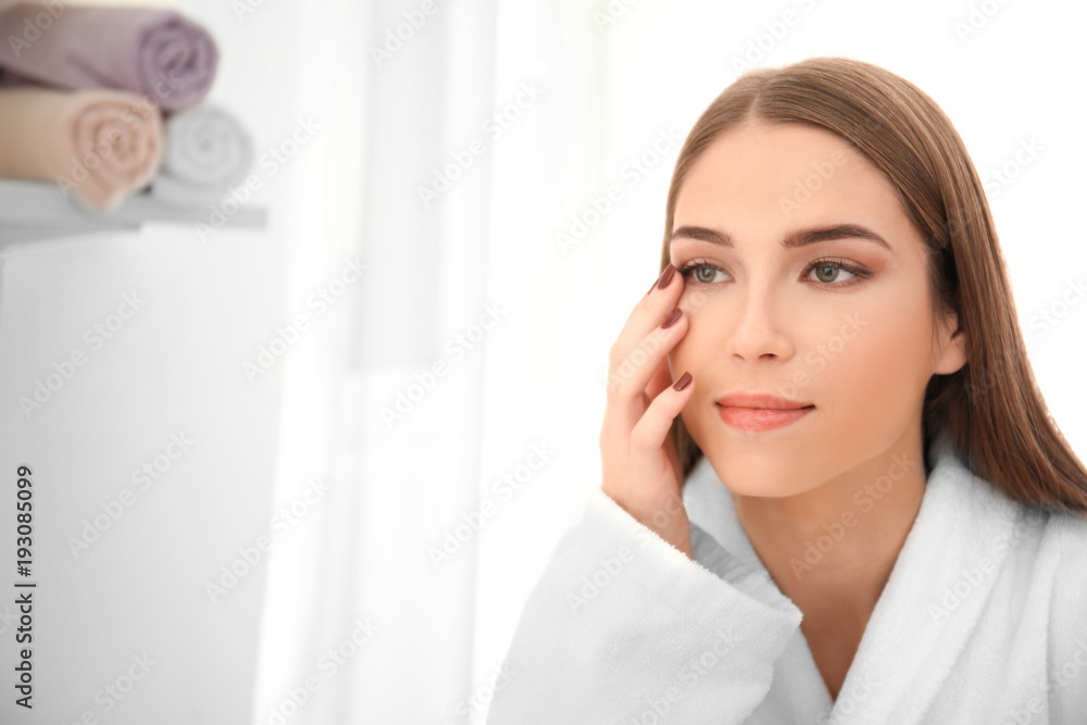 Young woman with beautiful makeup and long eyelashes indoors Young woman with beautiful makeup and long eyelashes indoors