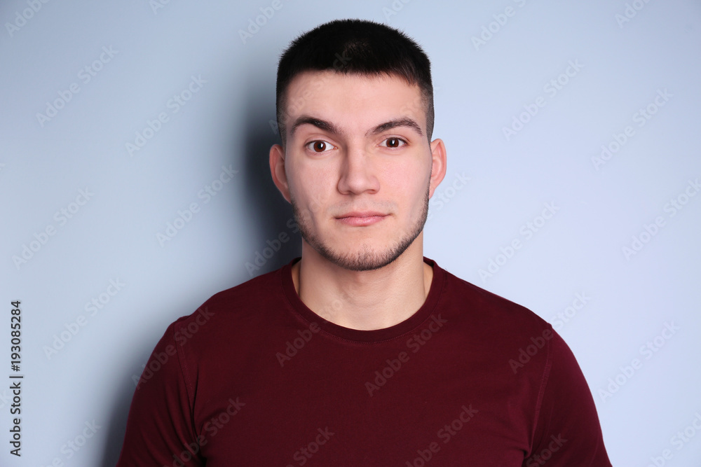 Young man with dyed eyebrows on light background Young man with dyed eyebrows on light background