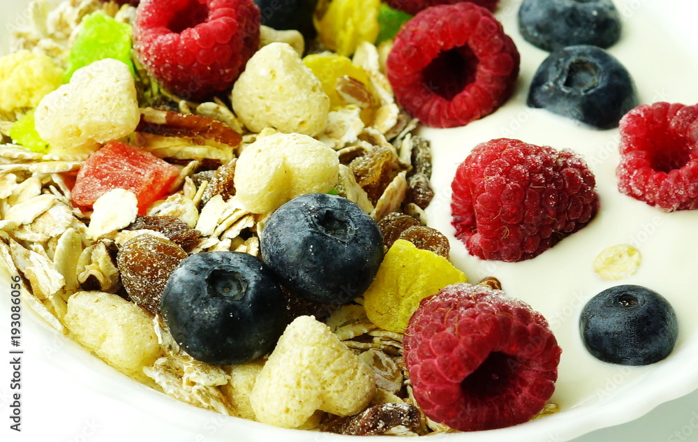 Healthy breakfast. Fresh granola, muesli with yogurt and berries on white wooden background.Close up Healthy breakfast. Fresh granola, muesli with yogurt and berries on white wooden background.Close up