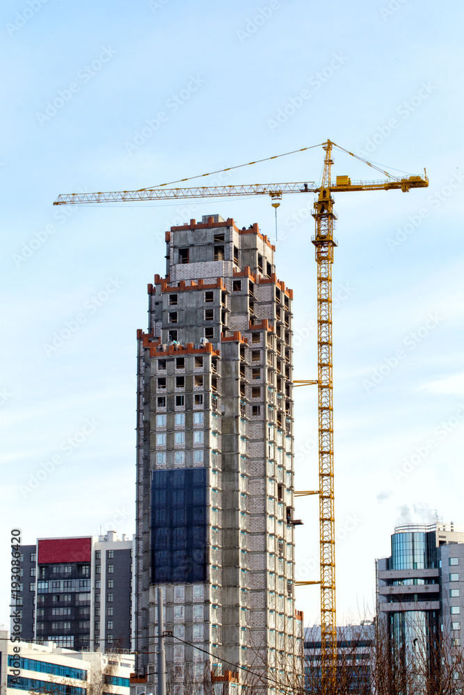Crane on a construction site. Construction of a skyscraper Crane on a construction site. Construction of a skyscraper