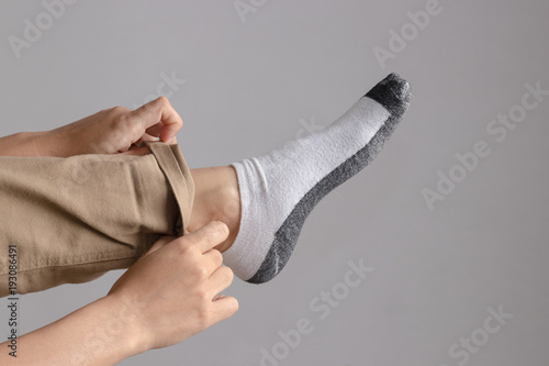 hand fold the pants isolated on white background.