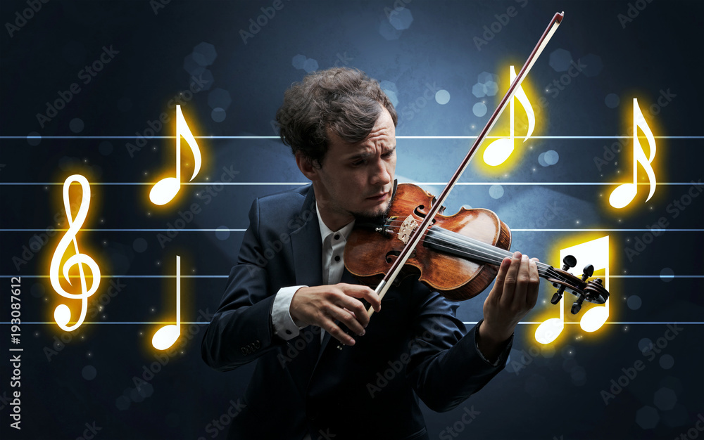 Fototapeta premium Young fiddler with music sheet