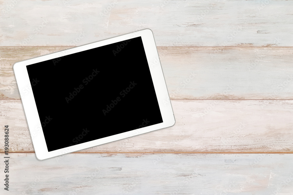 Mockup of a modern white and silver digital tablet on a wooden bright background (high angel view) Mockup of a modern white and silver digital tablet on a wooden bright background (high angel view)