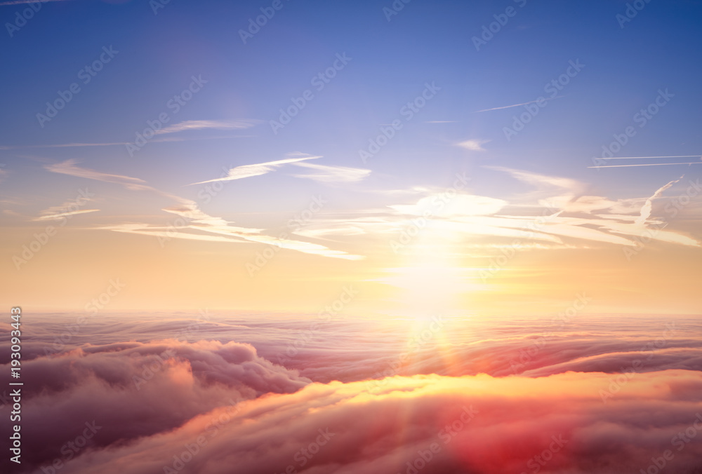 Beautiful aerial view above clouds with sunset.