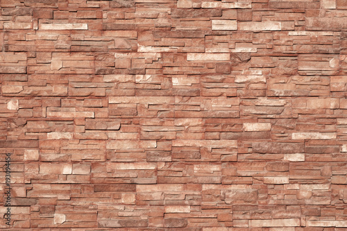 brownish texture of ceramic tiles glued to the outside of the building  bright color