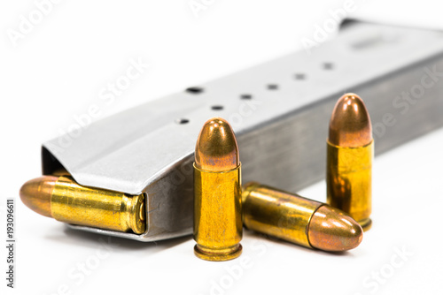 Bullets placed on the muzzle on a white background.