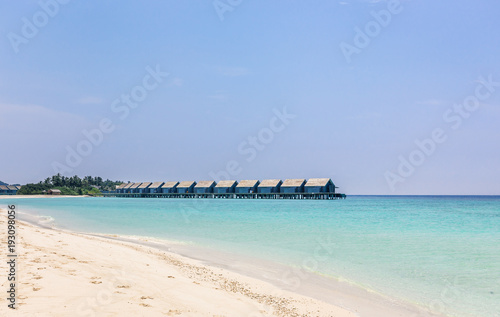 Blue lagoon and tropical island in Maldives