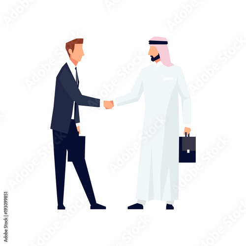 Businessmen shake hands.