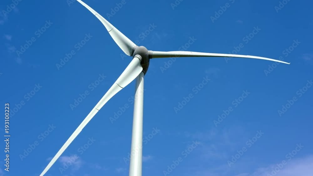 Wind power plants on blue sky background Wind power plants on blue sky background