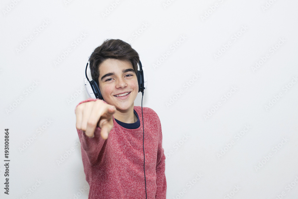 teen with headphones dancing on white background teen with headphones dancing on white background