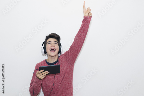 isolated child listening to music with headphones photo