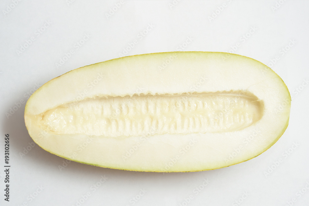 Beautiful and ripe yellow melon on a white background. Cut Beautiful and ripe yellow melon on a white background. Cut
