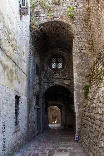 stone old corridor with round window