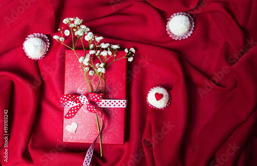 White flowers on red present box