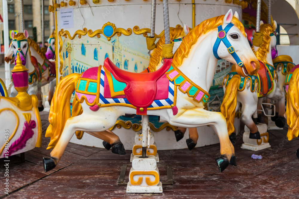 Carousel at a carnival or festival. Decorative ornate horse at a fun fair