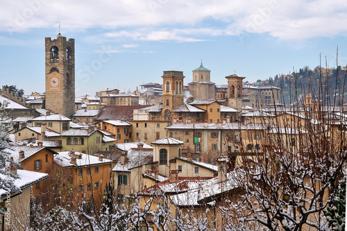 View of cityscape with bell tower during winter photo