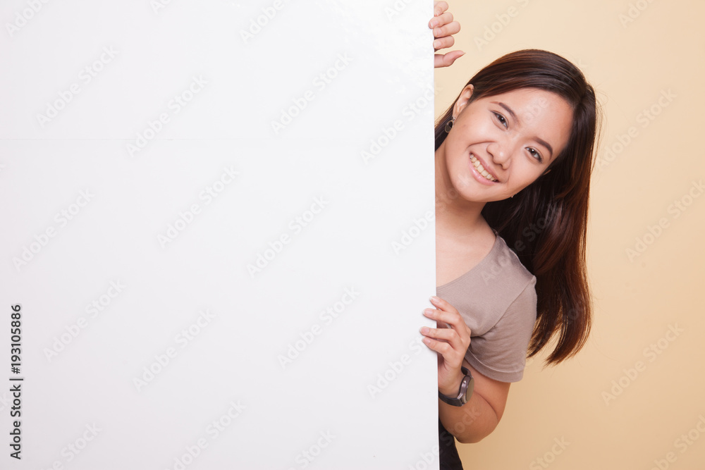Young Asian woman with blank sign. Young Asian woman with blank sign.