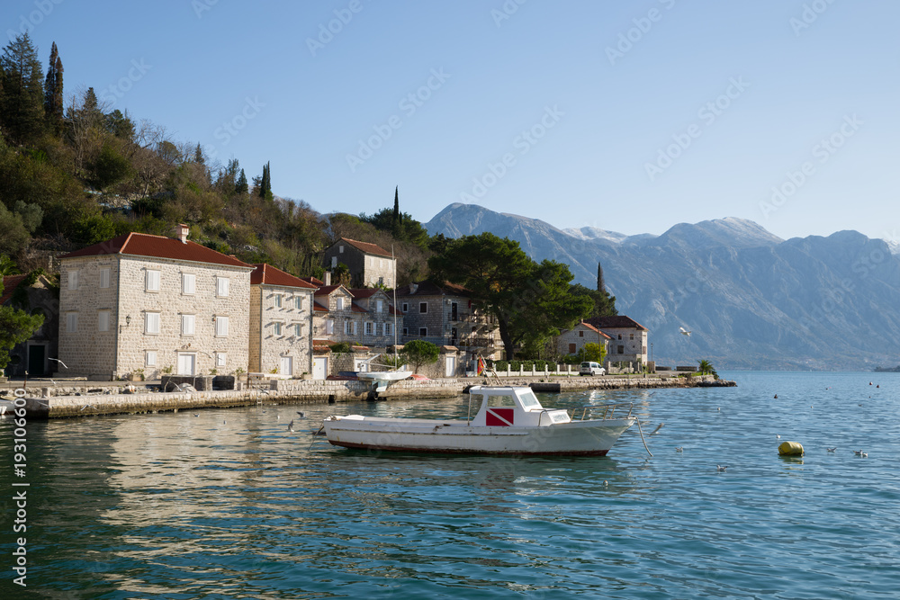 Beautiful view of the houses on the waterfront in Perest and the mountains in the background, Montenegro