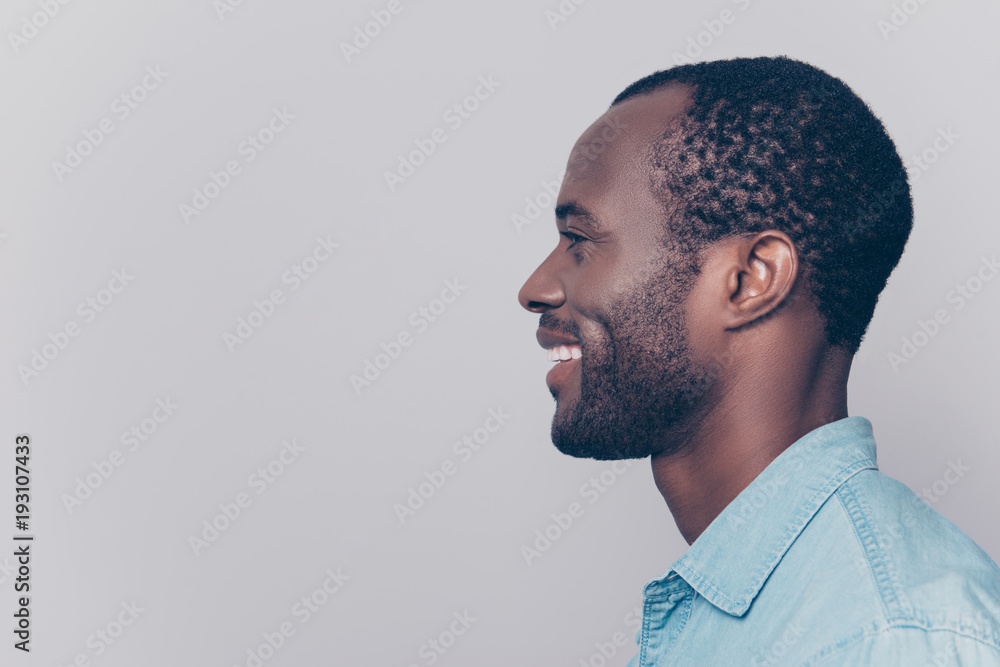 Profile, side view portrait with copy space, empty place for product of virile, smiling, manly, positive, cheerful man isolated on grey background Profile, side view portrait with copy space, empty place for product of virile, smiling, manly, positive, cheerful man isolated on grey background