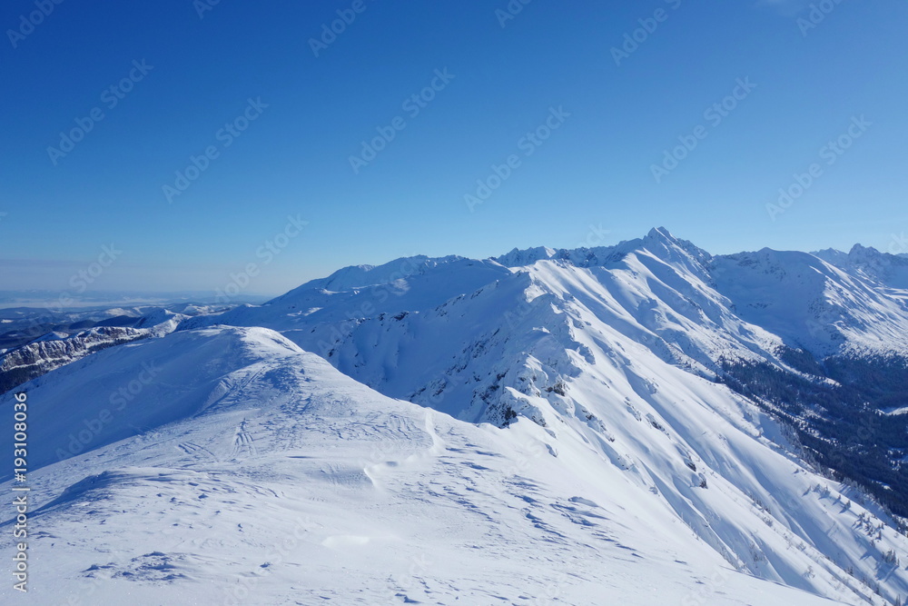 Obraz premium Top of Kopa Kondracka during winter with a view on Kasprowy Wierch, Zakopane, Tatry mountains, Poland